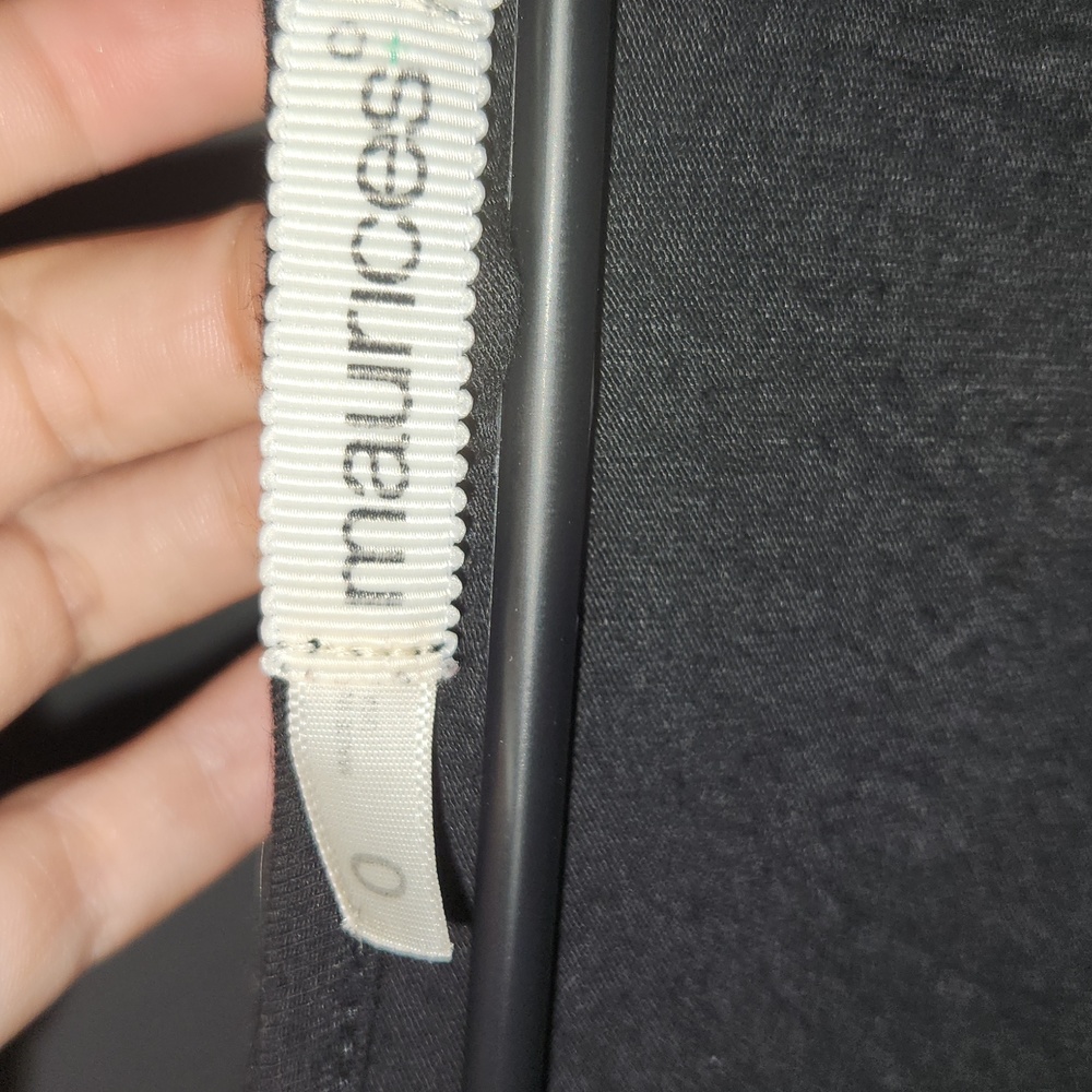 A black Maurices blouse with a low-cut neck. Long sleeve. Size 0.